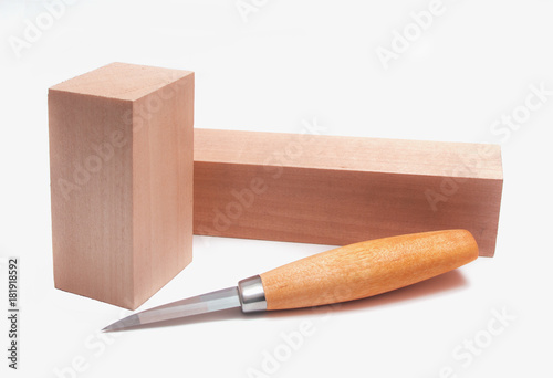 Knife for woodcarving and two wood blanks on white background