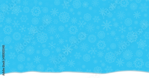 Elegant winter festive  blue background with fallen snowflakes and snowdrifts.