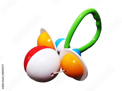 A colorful baby rattle on a white horizontal background photo