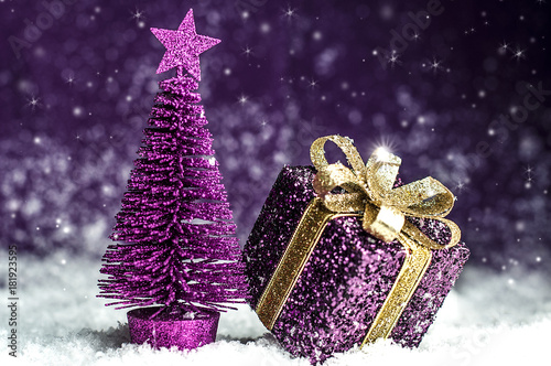 Christmas tree, purple gift with a gold bow