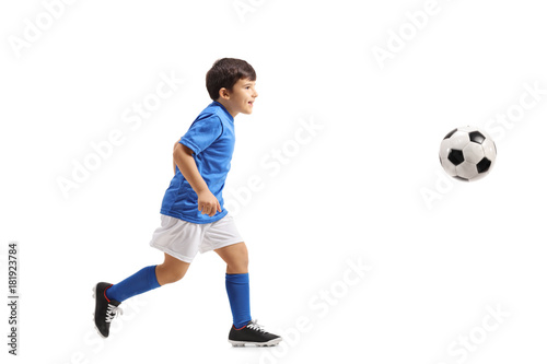 Fototapeta Naklejka Na Ścianę i Meble -  Little footballer running