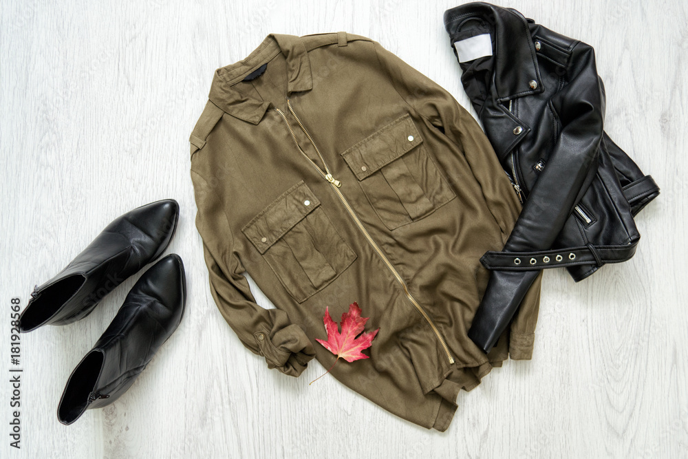 Khaki shirt, black jacket and shoes. Fashionable concept Khaki shirt, black jacket and shoes. Fashionable concept