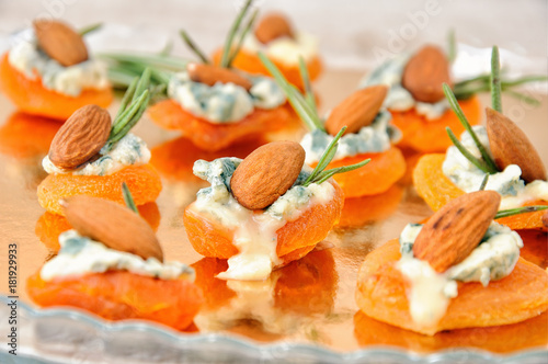 Sun-dried apricots with gorgonzola and almonds photo