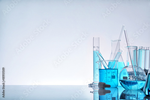 Assortment of glass containers for laboratory on the right