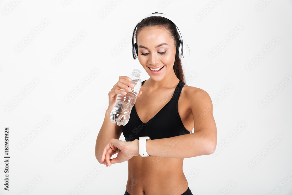 Portrait of a smiling asian fitness woman in headphones Portrait of a smiling asian fitness woman in headphones