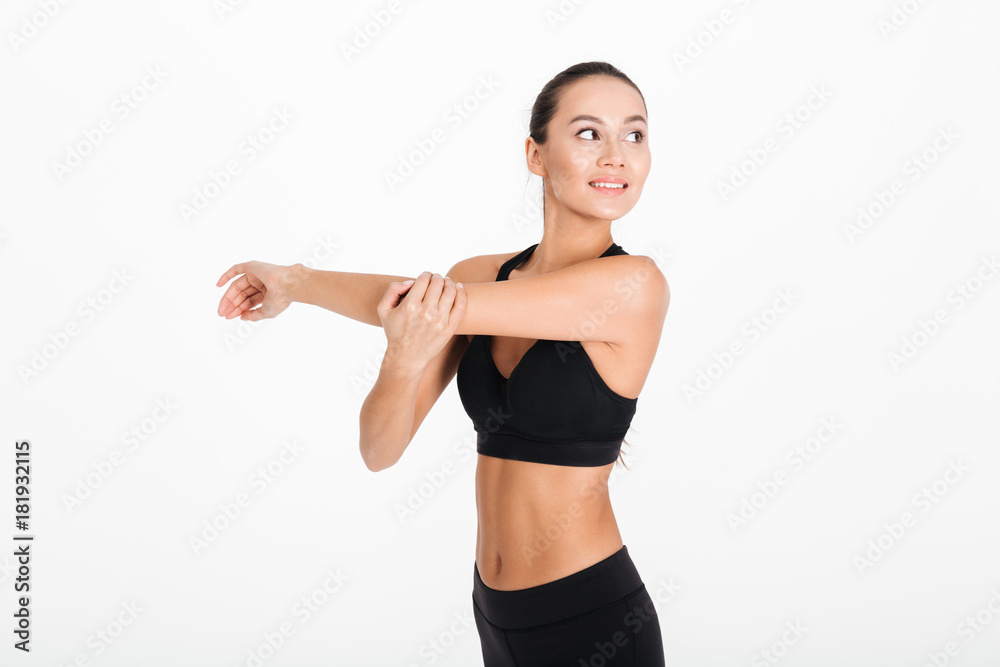 Portrait of a smiling fitness woman stretching her hands Portrait of a smiling fitness woman stretching her hands