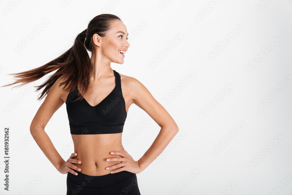 Portrait of a smiling asian fitness girl standing Portrait of a smiling asian fitness girl standing