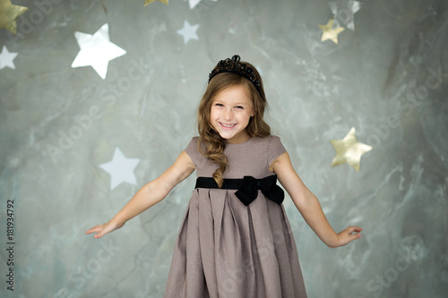 portrait of a happy girl on a background of stars
