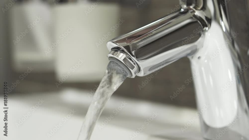 Clean drinking water from tap water. 4K UHD video. Clean drinking water from tap water. 4K UHD video.