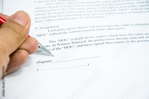 contracts agreement sign on document paper with red pen