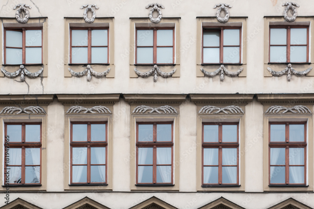 Ten windows on the facade of a vintage house