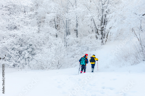  winter landscape in the mountains with falling snow and hiker trekking photo ,South Korea.