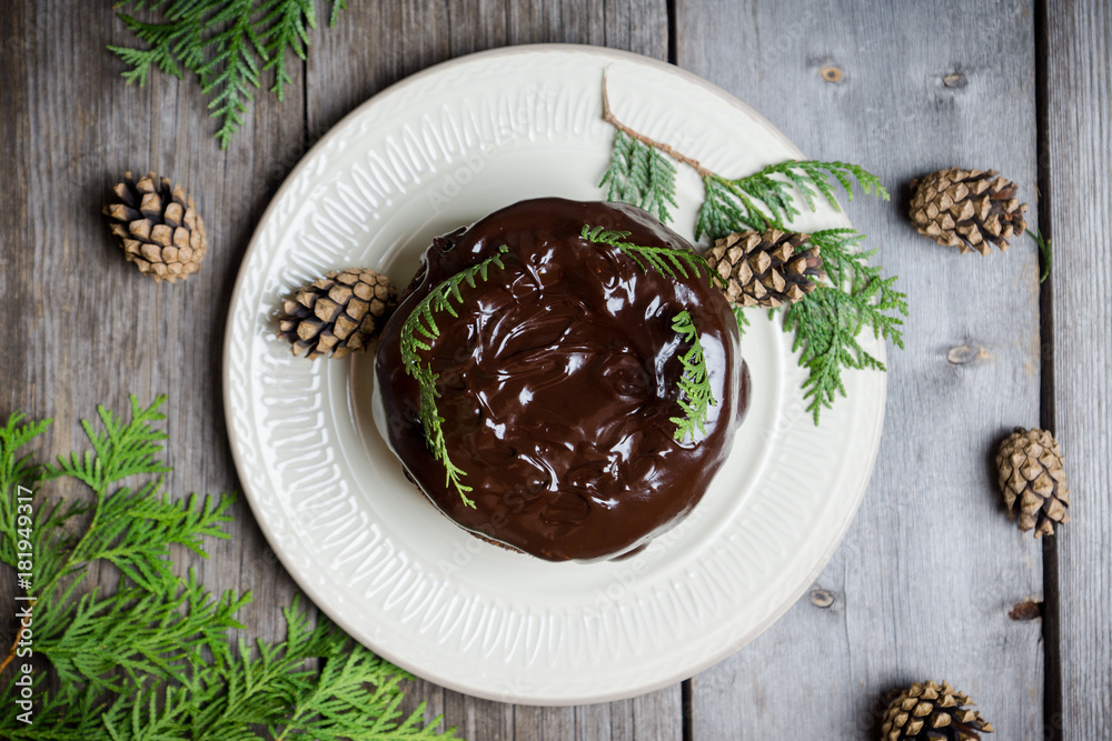 Creamy cake with chocolate glaze on the rustic background. Selective focus. Shallow depth of field. Creamy cake with chocolate glaze on the rustic background. Selective focus. Shallow depth of field.