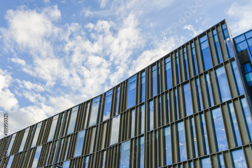 Texture of modern building from glass with blue sky