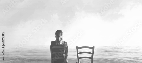 alone woman sitting next to her lover's empty chair photo