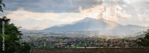 Panorama of Kathmandu valley, with cloudy sky and sunset, town and hills, from Shivapuri Nagsrjun National Park in Nepal. photo