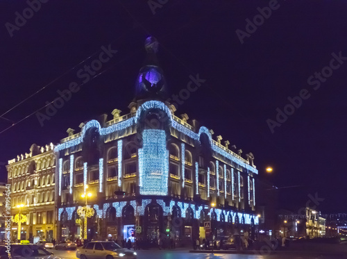 Evening city with New Year and Christmas decorations, Singer Company House ( 1902) on Nevsky Prospect. St. Petersburg. Russia..
