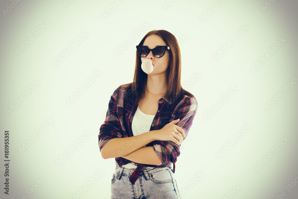 Fototapeta premium Young cute girl chews bubble gum 