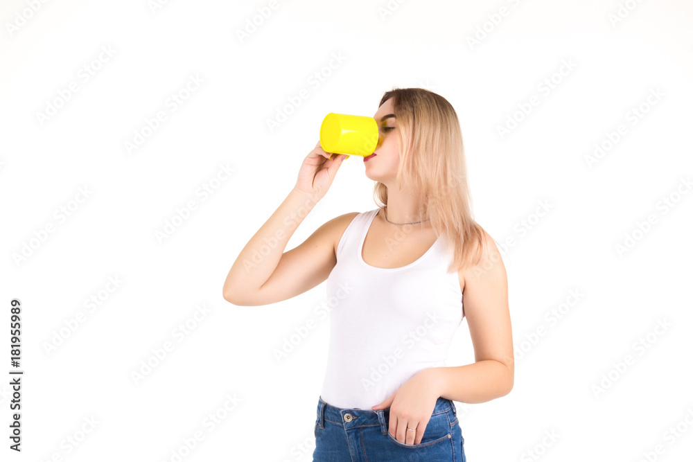 Young cute woman drinks coffee or tea, isolated Young cute woman drinks coffee or tea, isolated