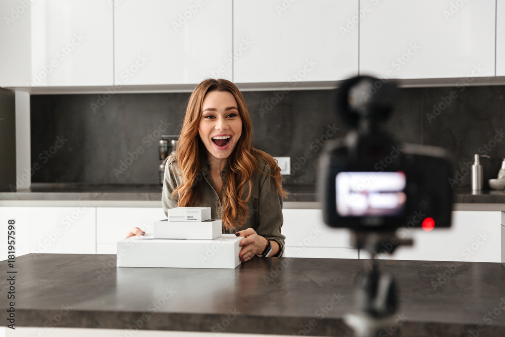 Happy young girl recording her video blog episode Happy young girl recording her video blog episode