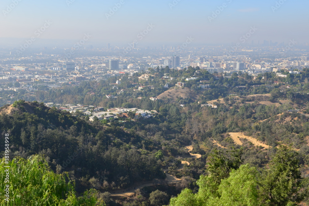 The Hollywood Hills overlooking a misty Los Angeles in the early morning
