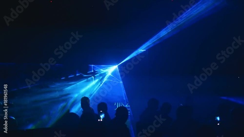 Colored laser light show in a club