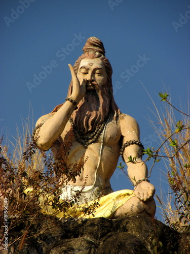 Yoga concept. Pranayama concept. Meditation concept. Statue of yogue in India.