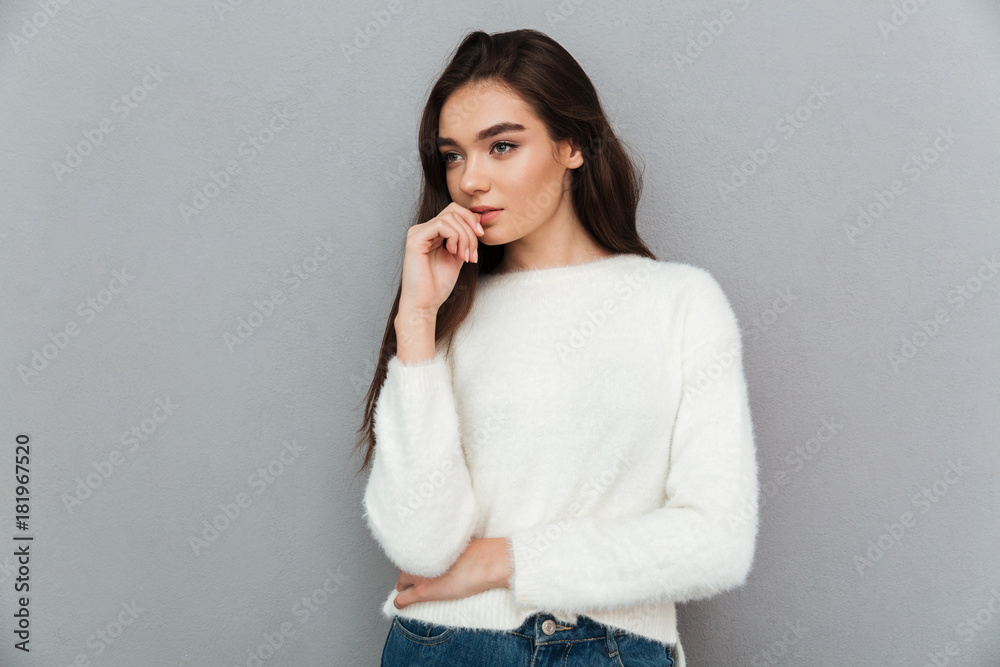 Close-up portrait of charming thoughtful brunette woman looking aside Close-up portrait of charming thoughtful brunette woman looking aside