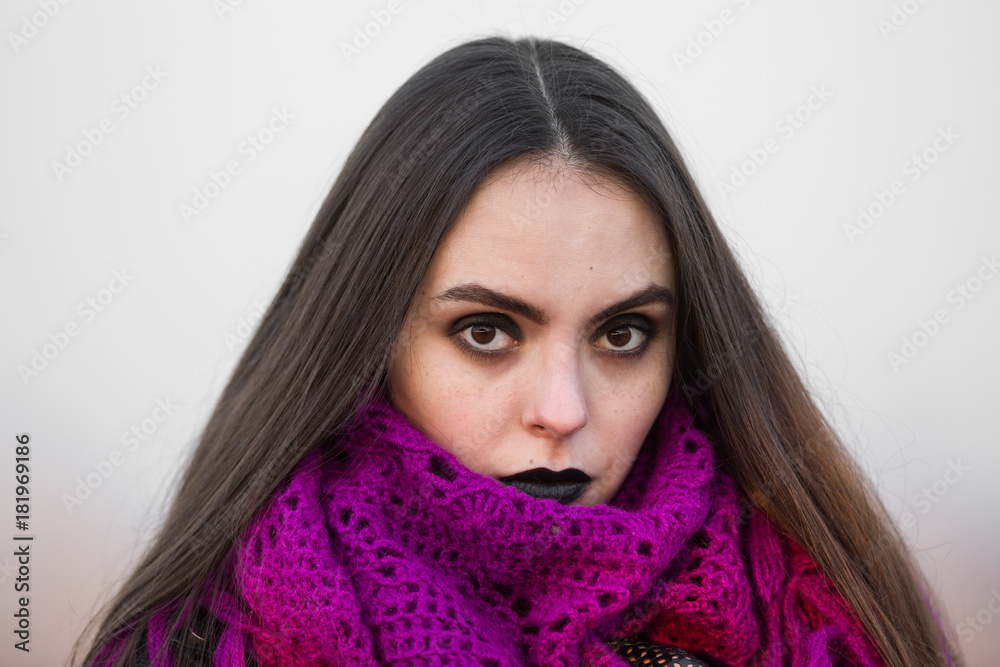 portrait of a brunette with black make-up