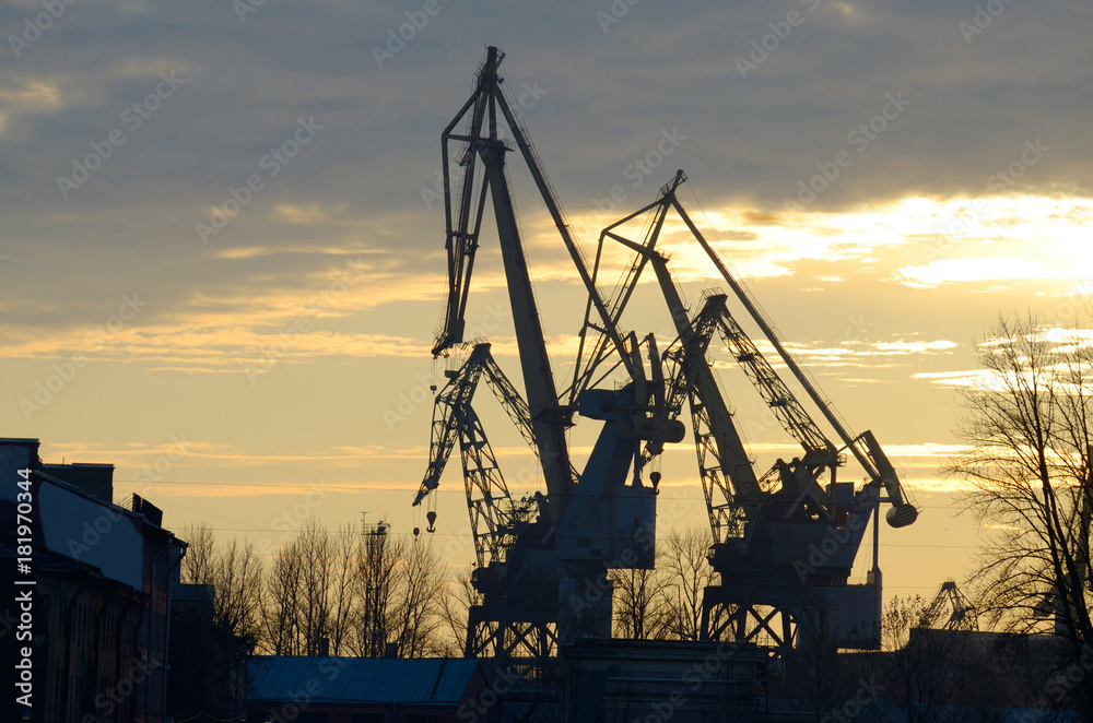 Shipbuilding cranes on sky background.