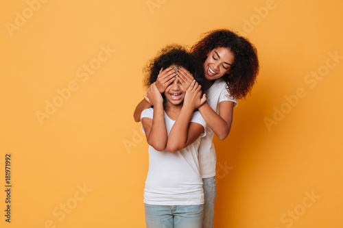 Two happy afro american sisters having fun