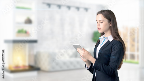 Young Business woman over interior background © Roman King