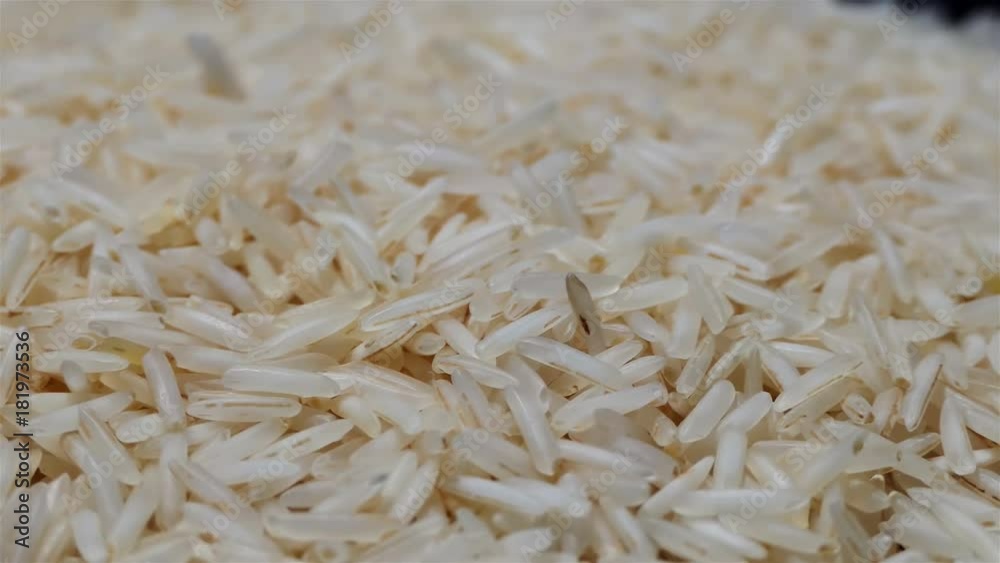 Close up Rice seeds rotating Slowly 4k. Food and drink background. Integral rice in slow motion. Long rice. dietary and healthy food. organic food concept full hd. Close up Rice seeds rotating Slowly 4k. Food and drink background. Integral rice in slow motion. Long rice. dietary and healthy food. organic food concept full hd.