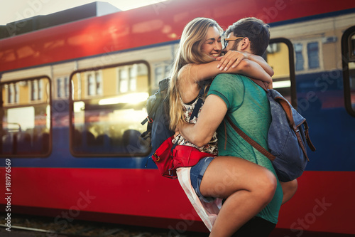 Beautiful couple parting at train station