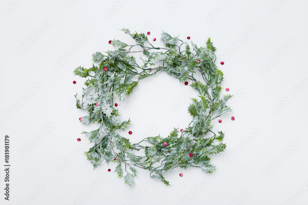 Christmas wreath, holly and red berries, flat lay Christmas wreath, holly and red berries, flat lay