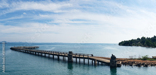 Port ferry boat with concrete ferry pier  panoramic view. Travel inspiration. Tropical landscape over sea with cloudy bright sky  Koh Chang island  Thailand.