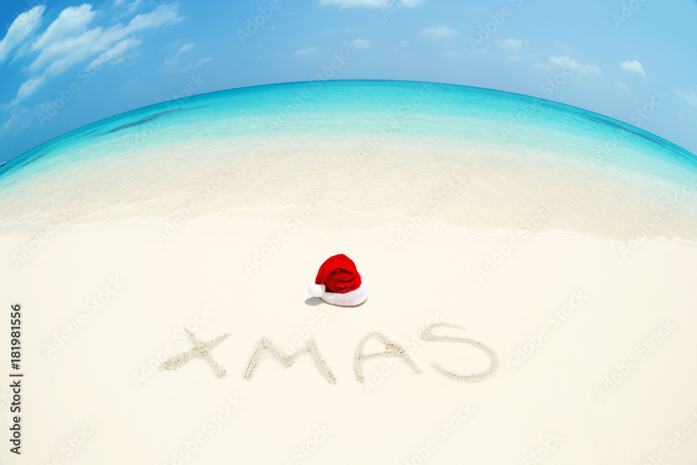Santa Claus hat on perfect tropical bounty beach Santa Claus hat on perfect tropical bounty beach