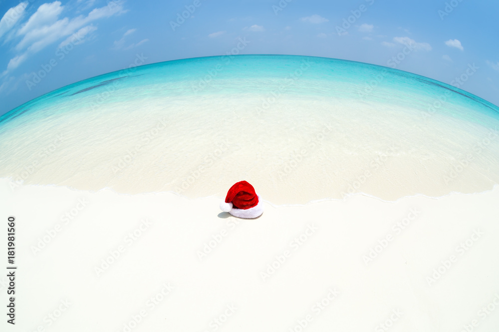Santa Claus hat on perfect tropical bounty beach Santa Claus hat on perfect tropical bounty beach