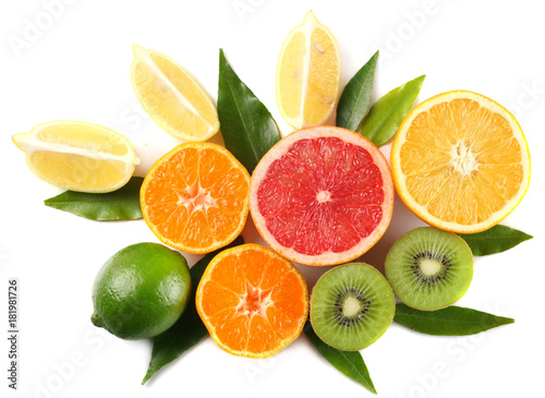 healthy food. mix sliced lemon, green lime, orange, mandarin, kiwi fruit and grapefruit with green leaf isolated on white background