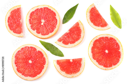 healthy food. sliced grapefruit with green leaf isolated on white background top view