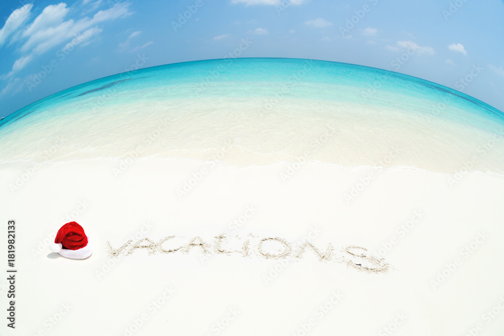 Santa Claus hat on perfect tropical bounty beach Santa Claus hat on perfect tropical bounty beach