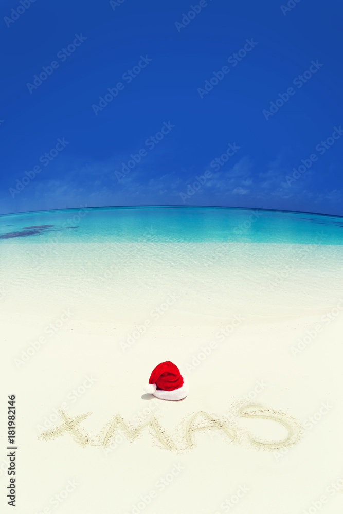 Xmas inscription written on sandy beach Xmas inscription written on sandy beach