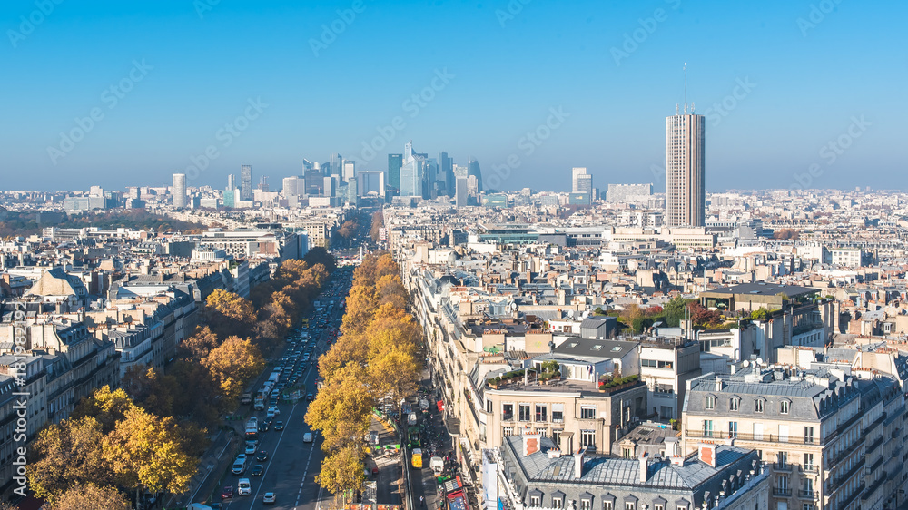 Paris, panorama from Arc de Triomphe, buildings, avenues and la Defense in background 
