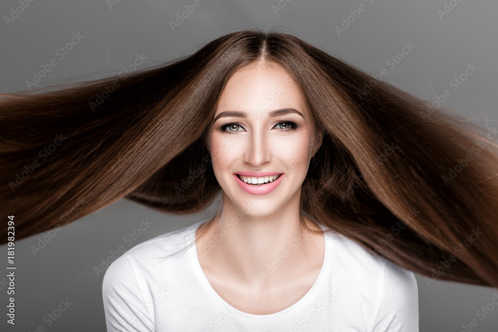 Naklejka premium woman with shiny straight long hair. 