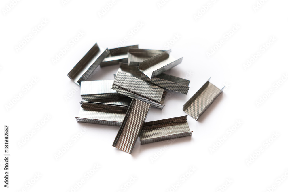 Stack of metal staples. Isolated on a white background. Stack of metal staples. Isolated on a white background.