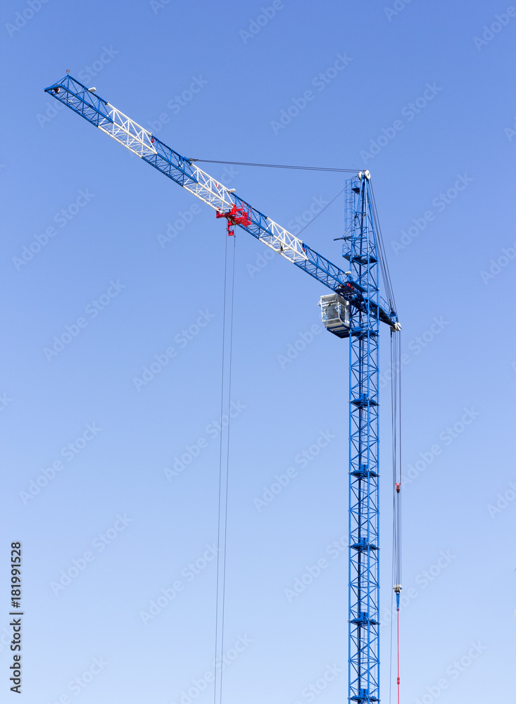 Industrial landscape with silhouettes of cranes on the sky background Industrial landscape with silhouettes of cranes on the sky background