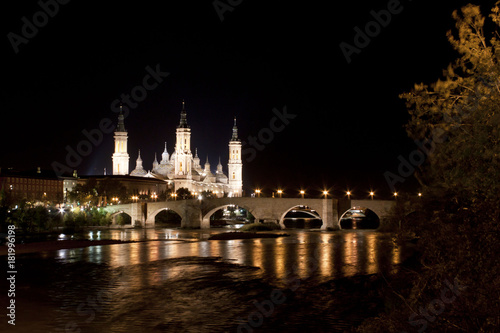 El Pilar cathedral in Zaragoza with the stone bridge, Spain