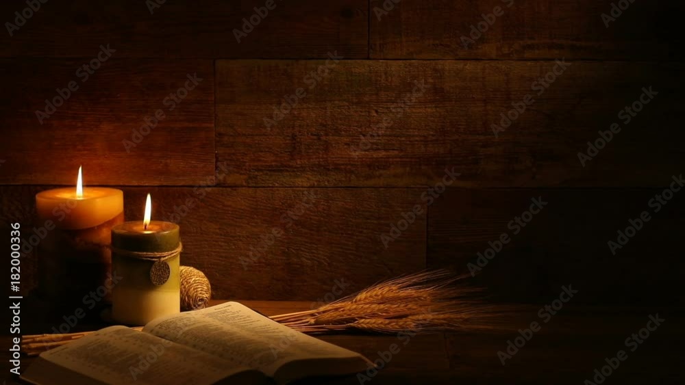 This is a close-up video symbolizing Thanksgiving, fall, autumn, using a Bible setting inside a barn background made up of old red wood.There's a lot of space for a copy In this video. 