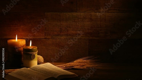 This is a close-up video symbolizing Thanksgiving, fall, autumn, using a Bible setting inside a barn background made up of old red wood.There's a lot of space for a copy In this video. 