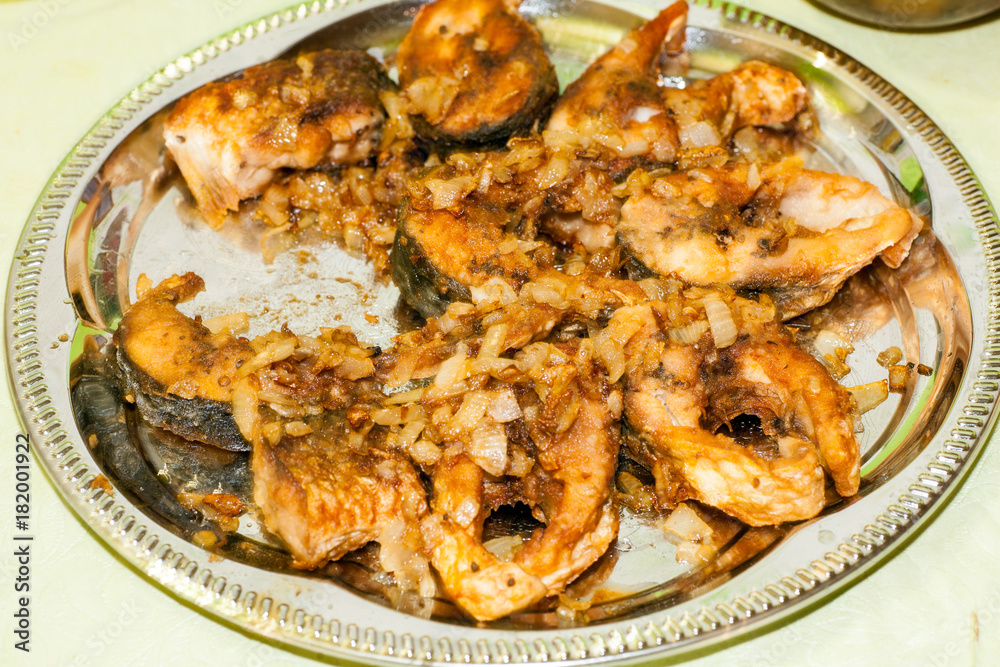 Dish from pieces of fried river fish for dinner in Russia Dish from pieces of fried river fish for dinner in Russia
